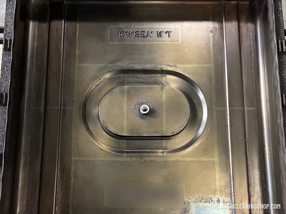 Steel production mold before laser cleaning — dark baked-on residue